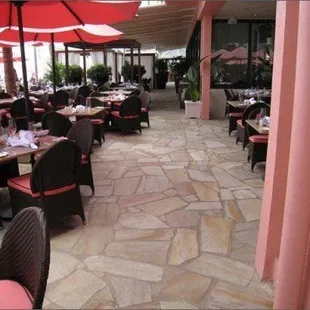 outdoor dining area with tables and umbrellas