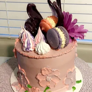 a cake decorated with macarons