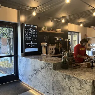 a man working in a coffee shop