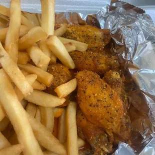 Chicken wings and fries.