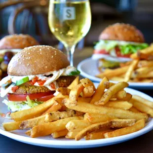 Try our Falafel Burger: spiced chickpea patty, crisp veggies, and creamy tahini dill sauce on a housemade vegan bun. Deliciously vegan!