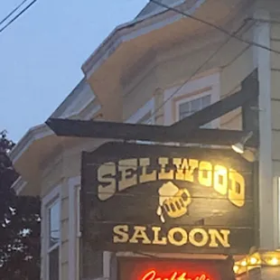 a neon sign in front of a building