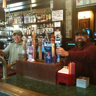 two men behind the bar