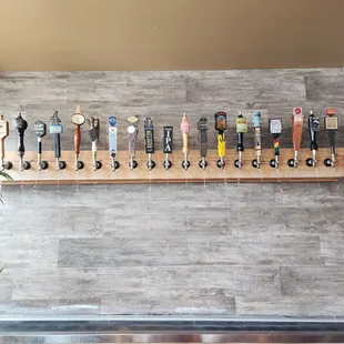 a row of beer taps