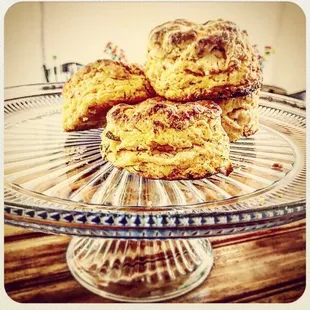three scones on a glass plate