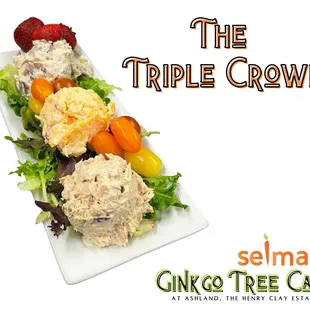 One scoop of each Housemade Salad: Chicken Salad,  Pimento Cheese and Olive Nut on a bed of Lettuce with a slice of Tomato.