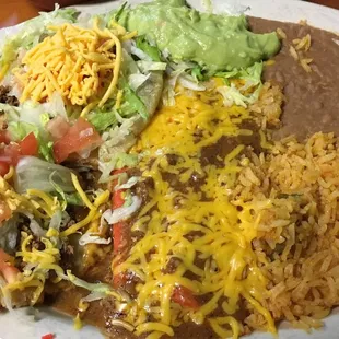 The #1 - 2 enchiladas and 2 puffy tacos, rice and beans