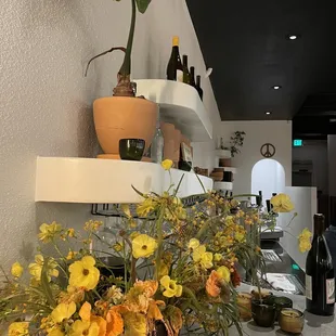 a vase of flowers on a counter