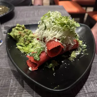 Fresh guacamole and taquitos