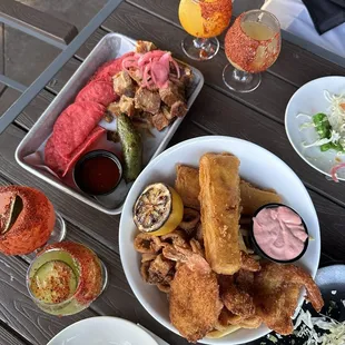Pork belly bites, seafood basket, margarita flight