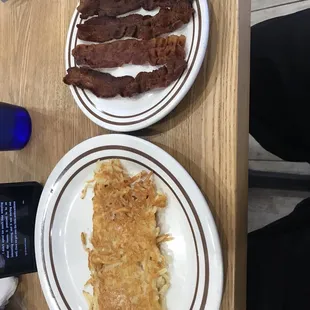 bacon and hash browns on plates