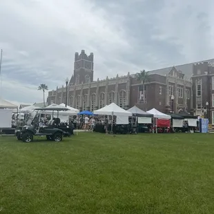 a large building with a clock tower in the background
