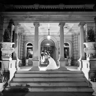 Bride and Groom on the front steps of Semple Mansion