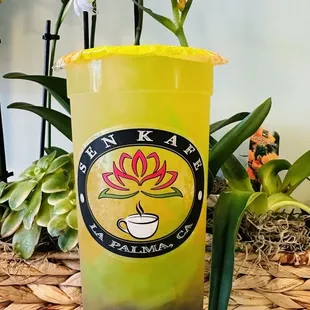 Mango Coconut refresher with green apply jelly and ube boba