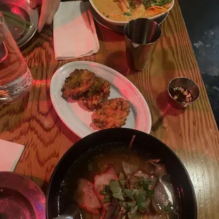 Tumeric coconut noodle soup, spicy corn Patties, ba mee giow muu dang