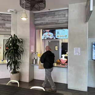 a man standing in front of the counter
