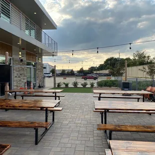 Beautiful outdoor patio with TV for sports and a gravel pit for the kids