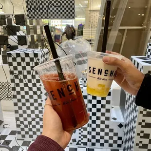 a person holding a cup of tea