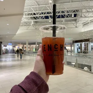 a person holding a cup of tea