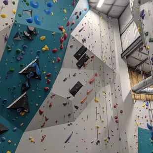 Lead climbing wall with some top rope on the right.