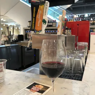 a glass of red wine on the counter