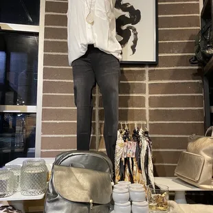 a woman standing on a shelf