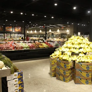 a display of bananas and melons