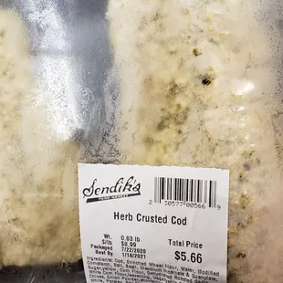 a sandwich wrapped in plastic