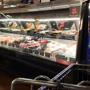 a man standing in front of a deli