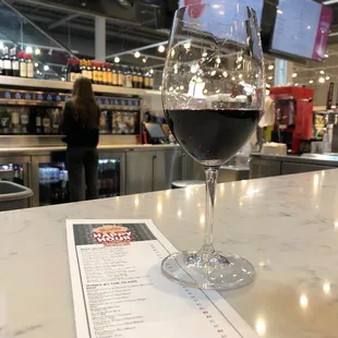 a glass of wine on a counter