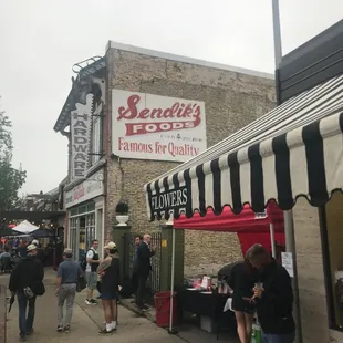 people walking down the sidewalk