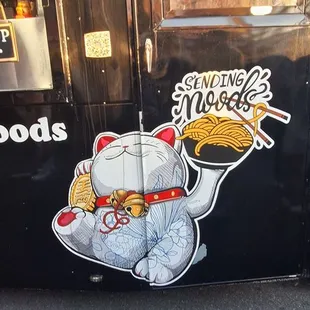 They're main logo. Lucky Cat with a bowl of "Noods". Yum.