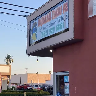 Store front new name sign.   Prices are a little too high