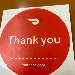 a thank you sticker on a table