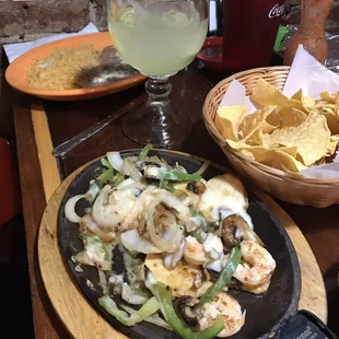 a plate of food and a glass of wine