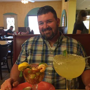 a man sitting at a table in a restaurant