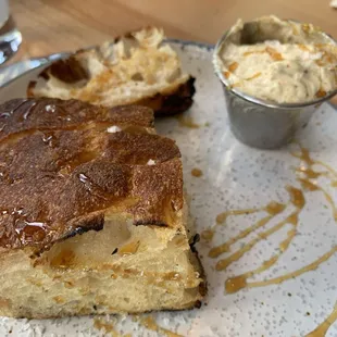 House Bread. Masa-enriched focaccia, roasted pepita butter, piloncillo syrup.