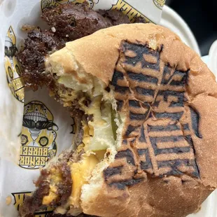 a half eaten sandwich with a bite taken out of it