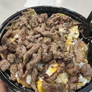 Chilaquiles bowl - green. Does that look like $5.99 worth of Carne Asada?