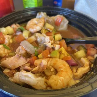 a bowl of shrimp and vegetables