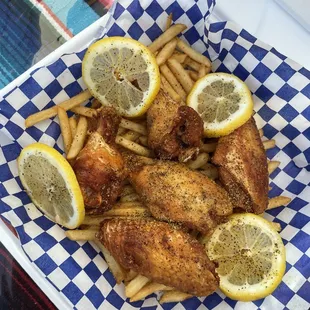 a plate of chicken and french fries