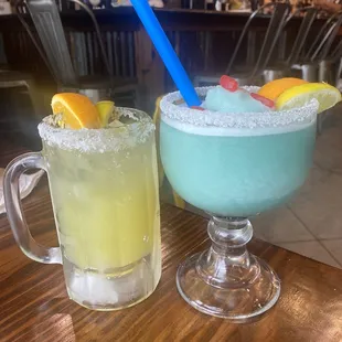 House Margarita on the rocks on the left and sweet frozen margarita on the right.