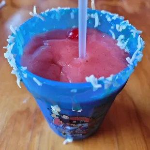 Super nom strawberry daiquiri with coconut flakes in a take-home cup!