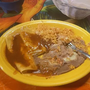 Enchiladas, beans and rice.