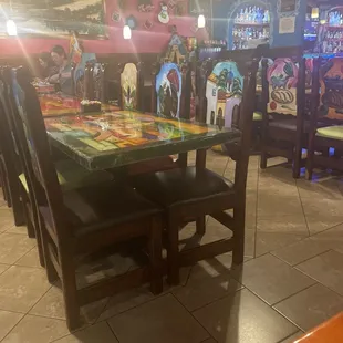 Tables and chairs, decorated brightly and ready for your meal!