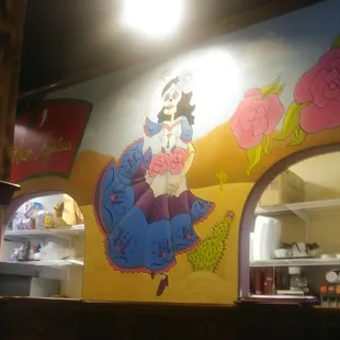 Love the mural in back by the kitchen.