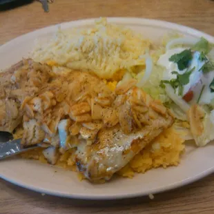 Awesome lunch.  Fish on classic garlic style with potatoes and salad.  Served over rice.