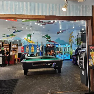 a pool table and arcade