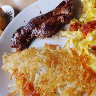 Steak and eggs with a side of sourdough toast.