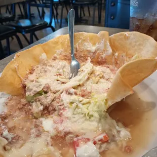 This is the taco salad my mother was served, would you eat it? Never saw a taco salad swimming before.